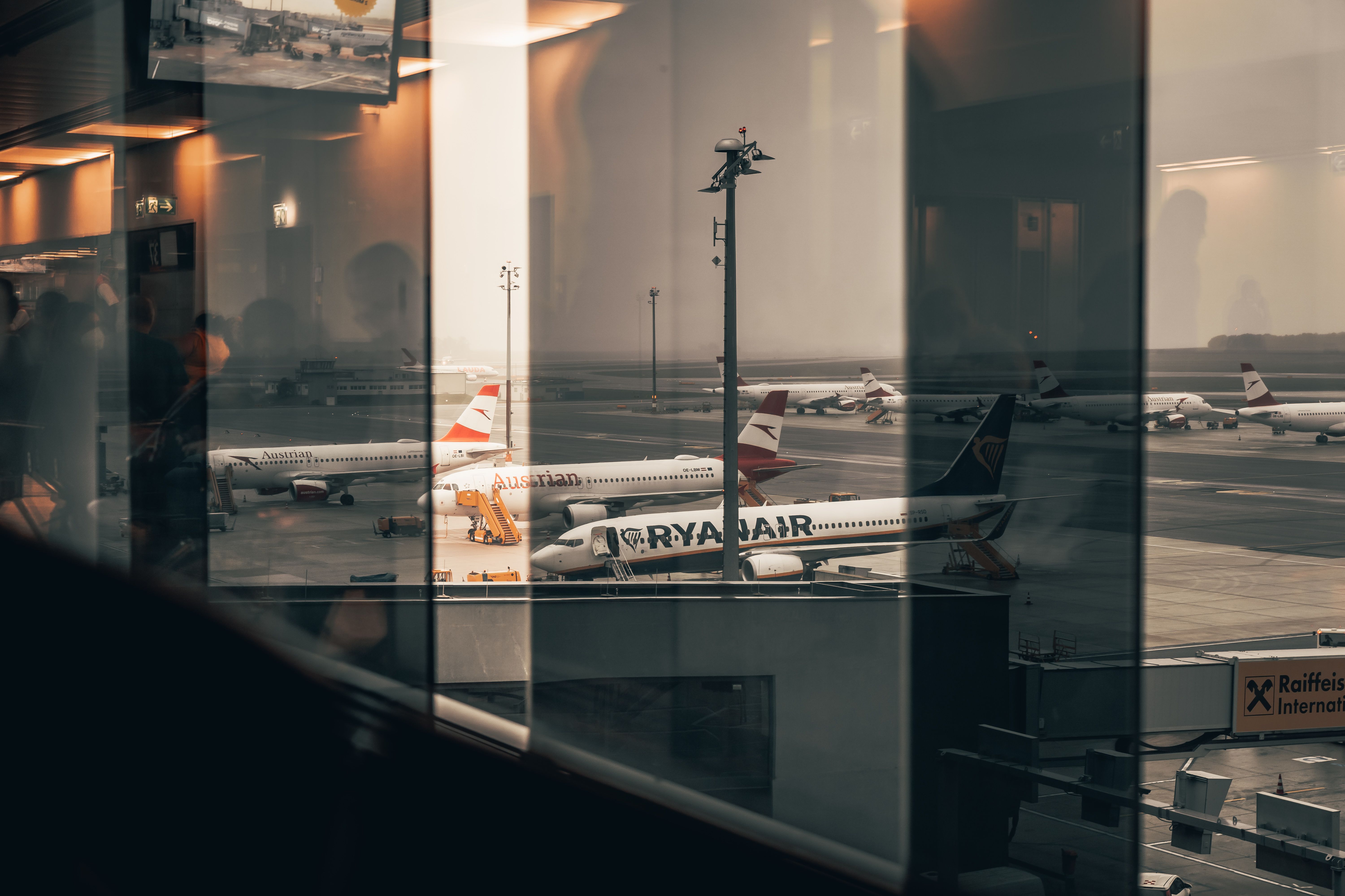 A busy airport terminal with travellers heading to their departure gates